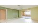Bright bedroom with tile flooring and sliding glass doors to enclosed patio at 1816 N Pebble Beach Blvd, Sun City Center, FL 33573