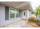 Inviting entryway with brick flooring and natural light, complemented by a white door at 1816 N Pebble Beach Blvd, Sun City Center, FL 33573