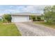 Charming home with a two-car garage, brick driveway, and well-maintained landscaping at 1816 N Pebble Beach Blvd, Sun City Center, FL 33573