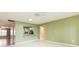 View of the living room showing the openness to the kitchen and hallway at 1816 N Pebble Beach Blvd, Sun City Center, FL 33573