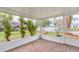 Relaxing screened patio offers a tranquil outdoor space with views of the lake and tropical foliage at 1816 N Pebble Beach Blvd, Sun City Center, FL 33573