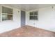 Covered patio featuring brick pavers, offering a cozy spot for outdoor seating and relaxation at 1816 N Pebble Beach Blvd, Sun City Center, FL 33573