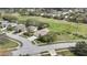 Aerial view of the property showcasing a scenic golf course view in the distance at 18951 Grand Club Dr, Hudson, FL 34667
