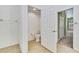 Powder room features a toilet with neutral tile flooring, providing convenience for guests at 18951 Grand Club Dr, Hudson, FL 34667