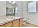 Bathroom with a single sink vanity and glass enclosed tiled shower at 18951 Grand Club Dr, Hudson, FL 34667