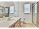 Bathroom with a single sink vanity and glass enclosed tiled shower at 18951 Grand Club Dr, Hudson, FL 34667