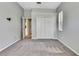 Bedroom with gray walls, neutral carpeting, closet, and natural light at 18951 Grand Club Dr, Hudson, FL 34667