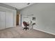 Cozy bedroom with gray walls, carpet, and a sewing machine at 18951 Grand Club Dr, Hudson, FL 34667