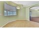Dining nook features a large picture window and hanging pendant lighting at 18951 Grand Club Dr, Hudson, FL 34667