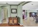 Inviting foyer area with wood floors and archways to the kitchen and living spaces at 18951 Grand Club Dr, Hudson, FL 34667