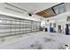Spacious two-car garage with overhead lighting, ample space, and a large garage door at 18951 Grand Club Dr, Hudson, FL 34667