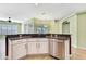 Kitchen sink and countertops showcase the kitchen's bright, open floor plan and adjacent breakfast nook at 18951 Grand Club Dr, Hudson, FL 34667