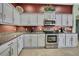 Close up of the kitchen featuring granite countertops and stainless steel appliances at 18951 Grand Club Dr, Hudson, FL 34667