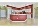 Spacious kitchen island with granite countertops, stainless steel appliances, and eat in dining space at 18951 Grand Club Dr, Hudson, FL 34667