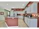 Stylish kitchen with a center island, granite countertops, stainless steel appliances, and ample counter space at 18951 Grand Club Dr, Hudson, FL 34667
