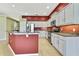 Bright kitchen area featuring stainless steel appliances, granite countertops and light gray cabinets at 18951 Grand Club Dr, Hudson, FL 34667