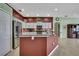 Kitchen showcasing an island, stainless steel appliances, granite counters, and plenty of cabinet space at 18951 Grand Club Dr, Hudson, FL 34667