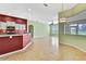 Open-concept living room area connecting dining and kitchen offers plenty of space and natural light at 18951 Grand Club Dr, Hudson, FL 34667