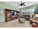 Bright living room with a media center, plush sofa, and lots of natural light at 18951 Grand Club Dr, Hudson, FL 34667