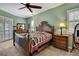 Comfortable main bedroom with a decorative ceiling fan and classic furnishings at 18951 Grand Club Dr, Hudson, FL 34667
