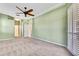 Large main bedroom featuring a neutral palette and access to an ensuite bathroom and ample closet space at 18951 Grand Club Dr, Hudson, FL 34667