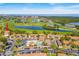 Aerial view showcasing the community, amenities, and surrounding green spaces and water features at 2073 Skimmer W Ct # 211, Clearwater, FL 33762