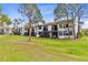 Backyard view showcasing lush greenery, screened-in patios, and tranquil outdoor living spaces at 2073 Skimmer W Ct # 211, Clearwater, FL 33762