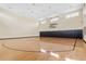 Indoor basketball court with hardwood floors, offering a great space for sports and recreational activities at 2073 Skimmer W Ct # 211, Clearwater, FL 33762