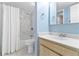 Bathroom featuring a sink and vanity, toilet, and shower with marble style shower walls at 2073 Skimmer W Ct # 211, Clearwater, FL 33762