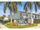 Charming community entrance with fountain and lush tropical landscaping, offering a welcoming atmosphere at 2073 Skimmer W Ct # 211, Clearwater, FL 33762
