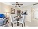Bright dining room with tile floors, ceiling fan, and adjacent to a modern kitchen at 2073 Skimmer W Ct # 211, Clearwater, FL 33762
