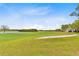 Scenic golf course with expansive green and blue sky at 2073 Skimmer W Ct # 211, Clearwater, FL 33762