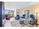 Comfortable living room with plush seating, stylish rug, and relaxing golf course views at 2073 Skimmer W Ct # 211, Clearwater, FL 33762