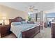 Main bedroom featuring a large bed, ceiling fan, and natural light at 2073 Skimmer W Ct # 211, Clearwater, FL 33762