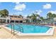 Community swimming pool with abundant seating and the recreation center nearby at 2073 Skimmer W Ct # 211, Clearwater, FL 33762
