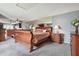 Bright bedroom featuring a large bed, nightstands, and a mirrored wall, creating a sense of openness and style at 20890 Negril Ct # 5, Lutz, FL 33558