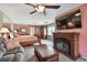 Spacious bedroom boasts a cozy fireplace, TV, and seamless integration of living and sleeping areas for ultimate comfort at 20890 Negril Ct # 5, Lutz, FL 33558