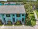 A beautiful aerial view of the townhome featuring lush landscaping and a well-maintained lawn at 20890 Negril Ct # 5, Lutz, FL 33558