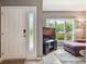 Inviting entryway features a decorative glass accent and opens to a living area with natural light at 20890 Negril Ct # 5, Lutz, FL 33558