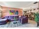 Cozy living room with modern decor, a large sofa, and an open view of the adjacent dining space at 20890 Negril Ct # 5, Lutz, FL 33558