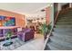 Open-concept living space with stylish decor, a comfortable sofa, and access to the dining area at 20890 Negril Ct # 5, Lutz, FL 33558