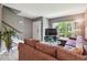 Inviting living room space with an abundance of natural light and cozy seating at 20890 Negril Ct # 5, Lutz, FL 33558