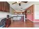 Bright office features hardwood floors, a built-in desk with storage, and a view into the living room at 20890 Negril Ct # 5, Lutz, FL 33558