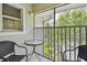 Cozy screened-in balcony with comfortable seating, perfect for relaxing and enjoying the outdoors at 21103 Patio View Ct # 3305, Lutz, FL 33558