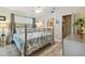 Charming bedroom featuring a decorative metal bed frame and a neutral color palette at 21103 Patio View Ct # 3305, Lutz, FL 33558