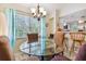 Bright dining area with large window, contemporary chandelier, and bar seating at 21103 Patio View Ct # 3305, Lutz, FL 33558