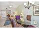 Dining area with table, chairs, and view to the living area and entry at 21103 Patio View Ct # 3305, Lutz, FL 33558
