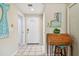 Inviting entryway with white door, decorative secretary, and coastal decor at 21103 Patio View Ct # 3305, Lutz, FL 33558