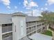 Exterior view of a condo building with covered parking and multiple stories at 21103 Patio View Ct # 3305, Lutz, FL 33558