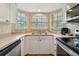 Galley style kitchen with bay window and stainless steel appliances at 21103 Patio View Ct # 3305, Lutz, FL 33558